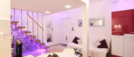 Lilla Apartment | Living room | Flat-screen TV, fireplace, DVD player, heated floors