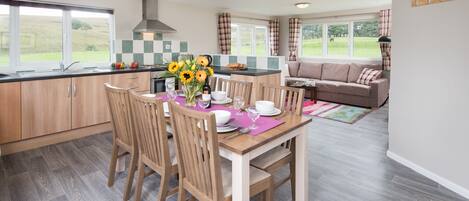 Cabin, 3 Bedrooms (Pennine Lodge) | Private kitchen | Electric kettle, toaster, high chair, dining tables