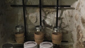 A shelf with jars labeled 'coffee' and 'sugar', and a salt and pepper shaker. - Cozy House Parga (Parga)
