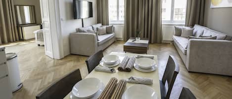Deluxe Suite, 2 Bedrooms | Living area | 50-inch LCD TV with premium TV channels, TV