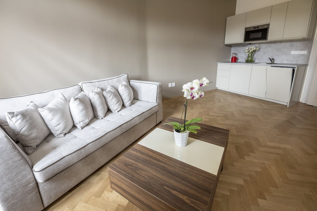 Standard Suite, 1 Bedroom | Living area | 50-inch LCD TV with premium TV channels, TV