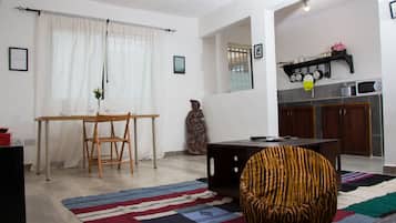 Double Room, 2 Bedrooms | Living room | Flat-screen TV