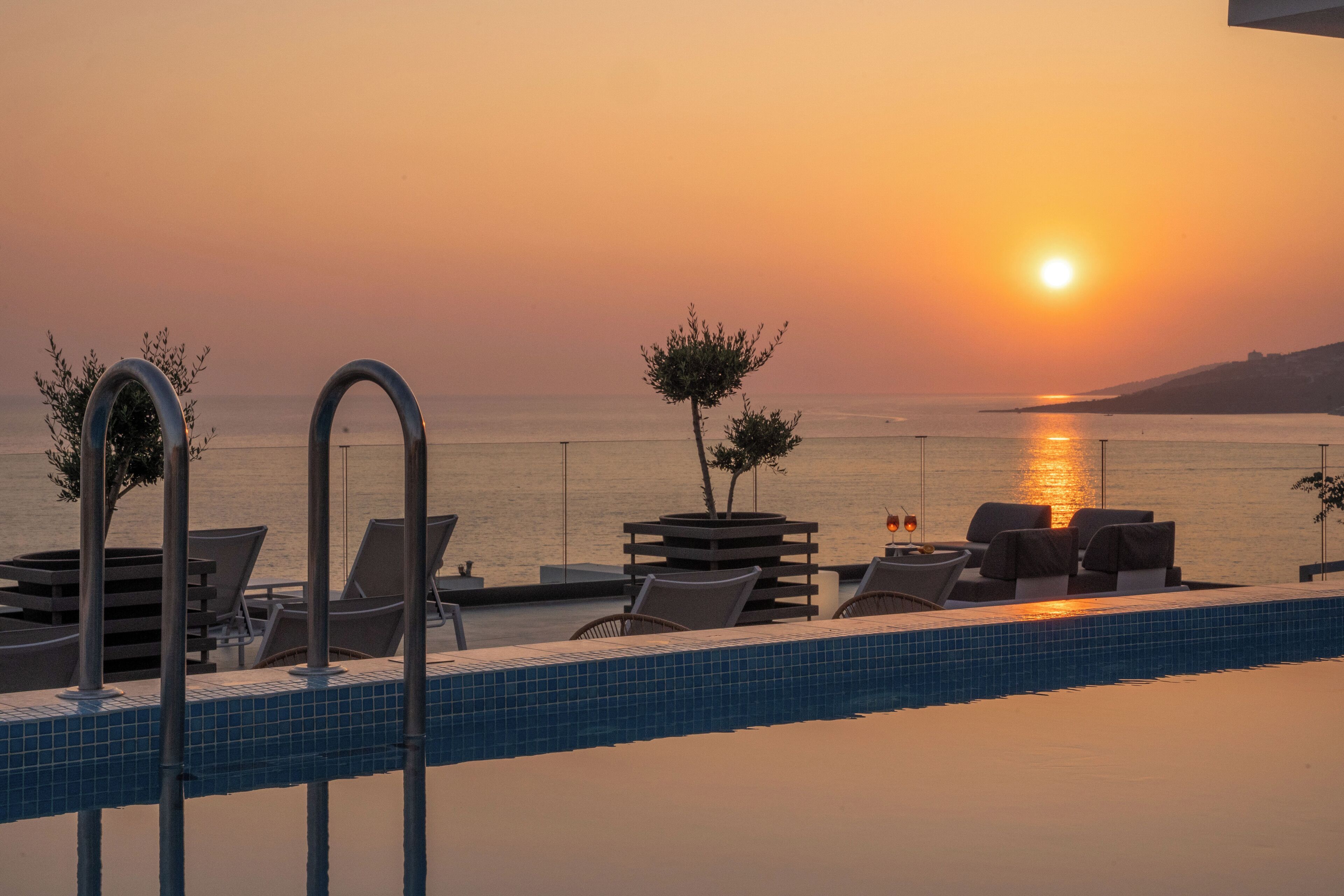 seasonal outdoor pool, pool umbrellas, pool loungers