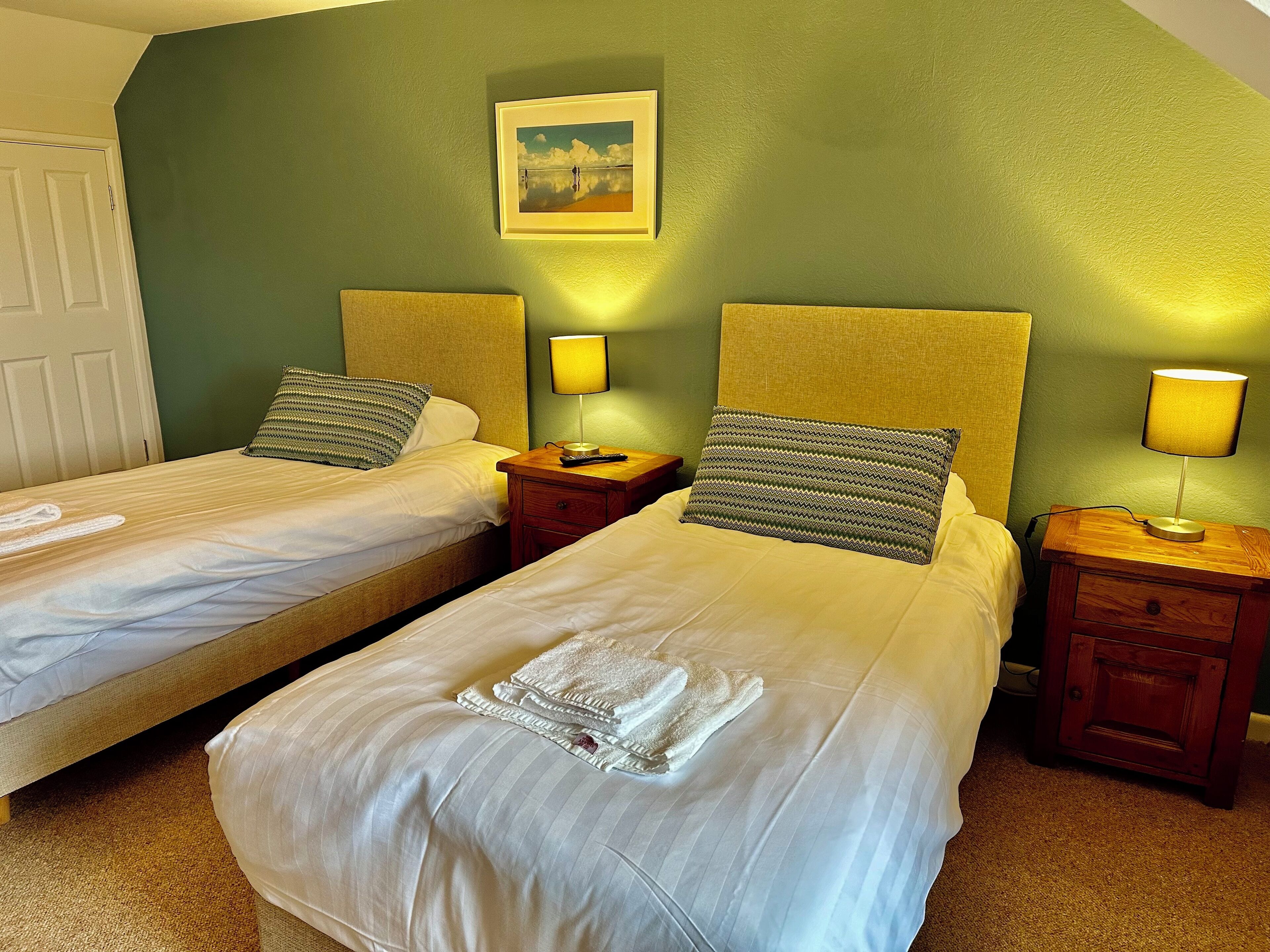 standard twin room, garden view | hypo-allergenic bedding, down duvets, blackout curtains