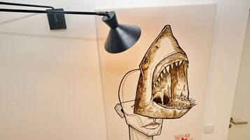 A wall with a large shark illustration and a red star.