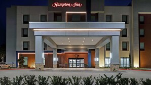 A modern Hampton Inn hotel with a prominent entrance, large windows, and a well-lit facade. - Hampton Inn Weslaco (Weslaco)