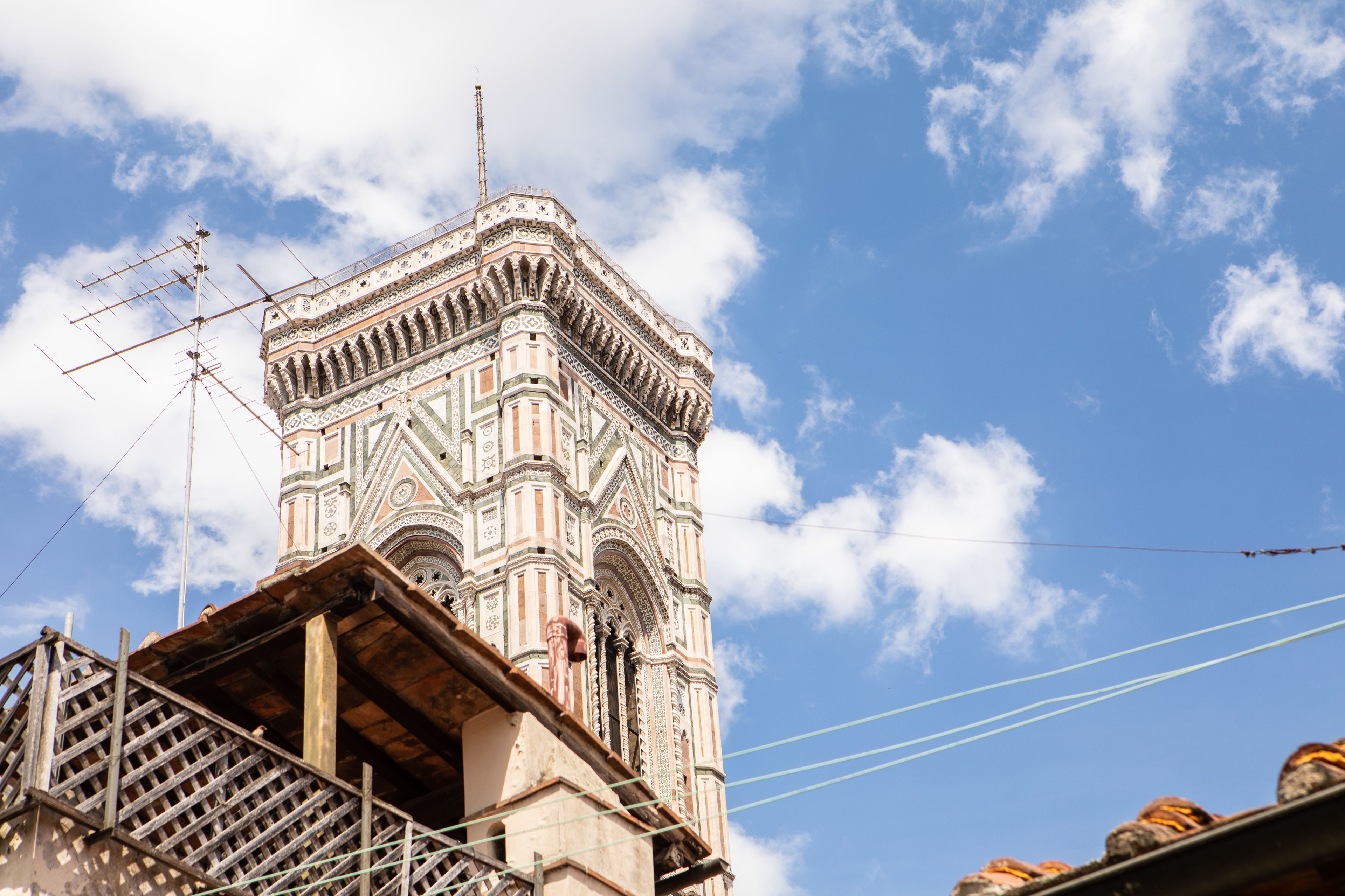 A historic building with intricate architectural details and a prominent tower.