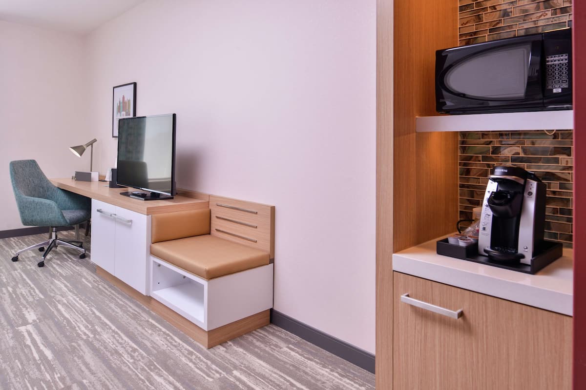 minibar, desk, blackout curtains, iron/ironing board