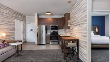 Suite, 1 Bedroom | Desk, laptop workspace, iron/ironing board, bed sheets