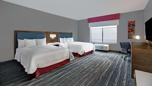 A hotel room with two beds, a desk, a chair, and a large window. - Hampton Inn Weslaco (Weslaco)