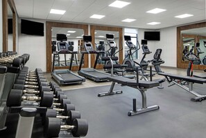 A gym with treadmills, elliptical machines, and dumbbells. - Hampton Inn Weslaco (Weslaco)