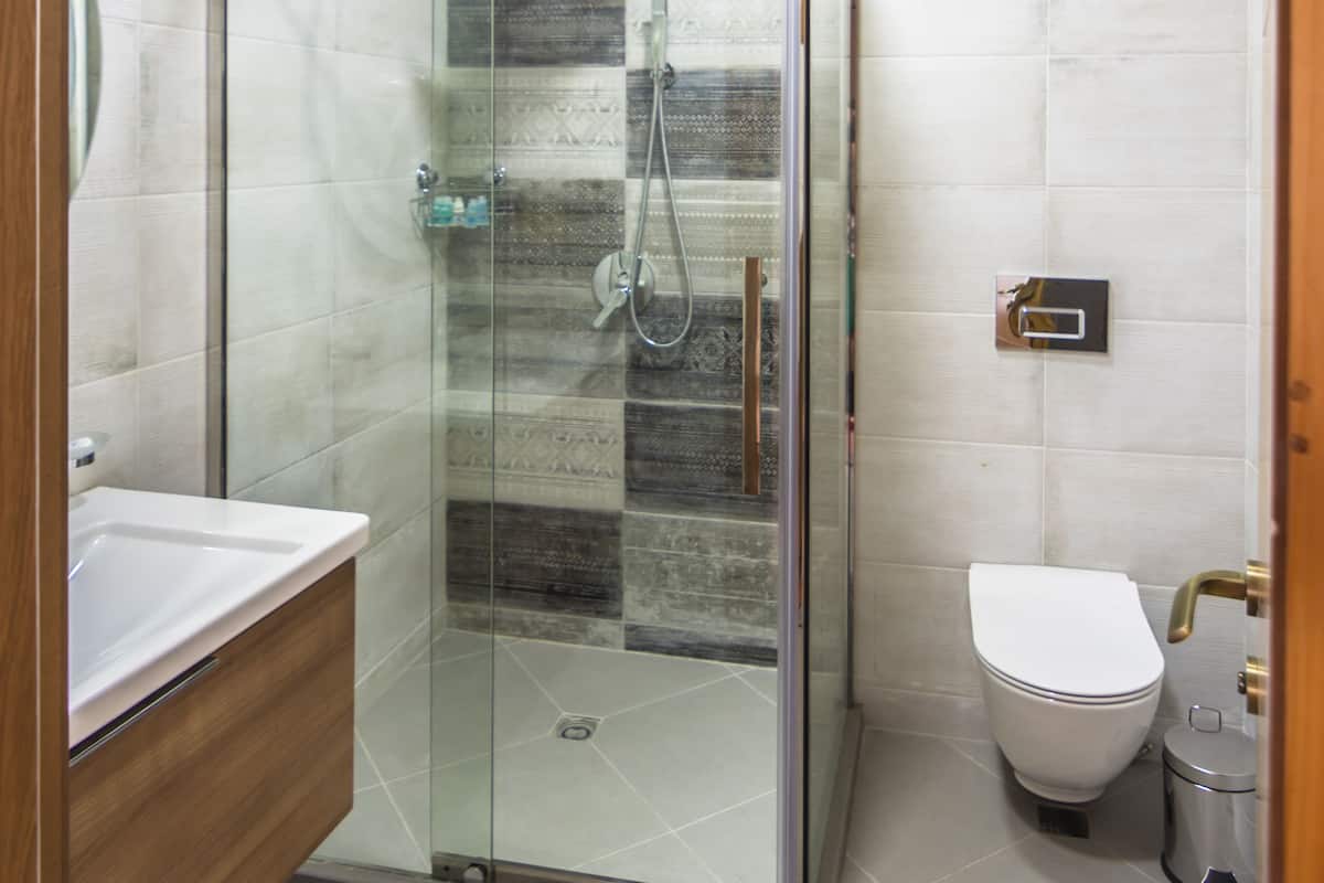 suite, city view | bathroom | free toiletries, hair dryer, dressing gowns, slippers