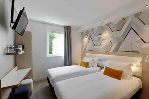 Premium bedding, desk, laptop workspace, blackout drapes