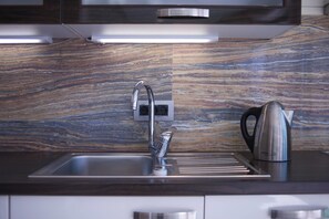 Apartment, Sea View | Private kitchen | Fridge, stovetop, dishwasher, electric kettle