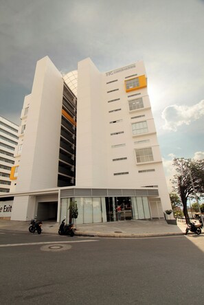 Stunning building with a glass facade, vertical elements, and a distinctive accent on the upper floors.