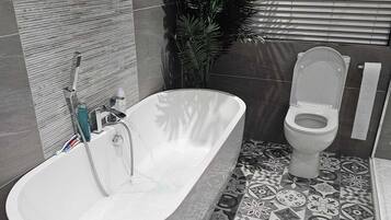 Combined shower/tub, hair dryer, towels, soap