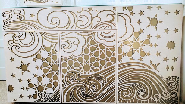 A decorative wooden partition with intricate cut-out patterns of stars and waves. - Perfect Location - 4BD,1BA - Restored Redwood Home of SF Artists (SF)