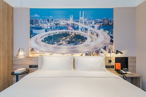 Premium bedding, down duvets, memory-foam beds, desk
