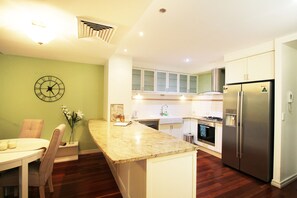 Two Bedroom Apartment | Private kitchen | Full-size fridge, microwave, oven, stovetop - Grey St Residence (South Brisbane)