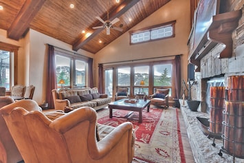 Comfortable Living Room with a Vaulted Wood Ceiling