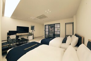 A hotel room with two beds, a desk, a chair, a television, and a large window. - Balsan Golden Hotel (Seoul)