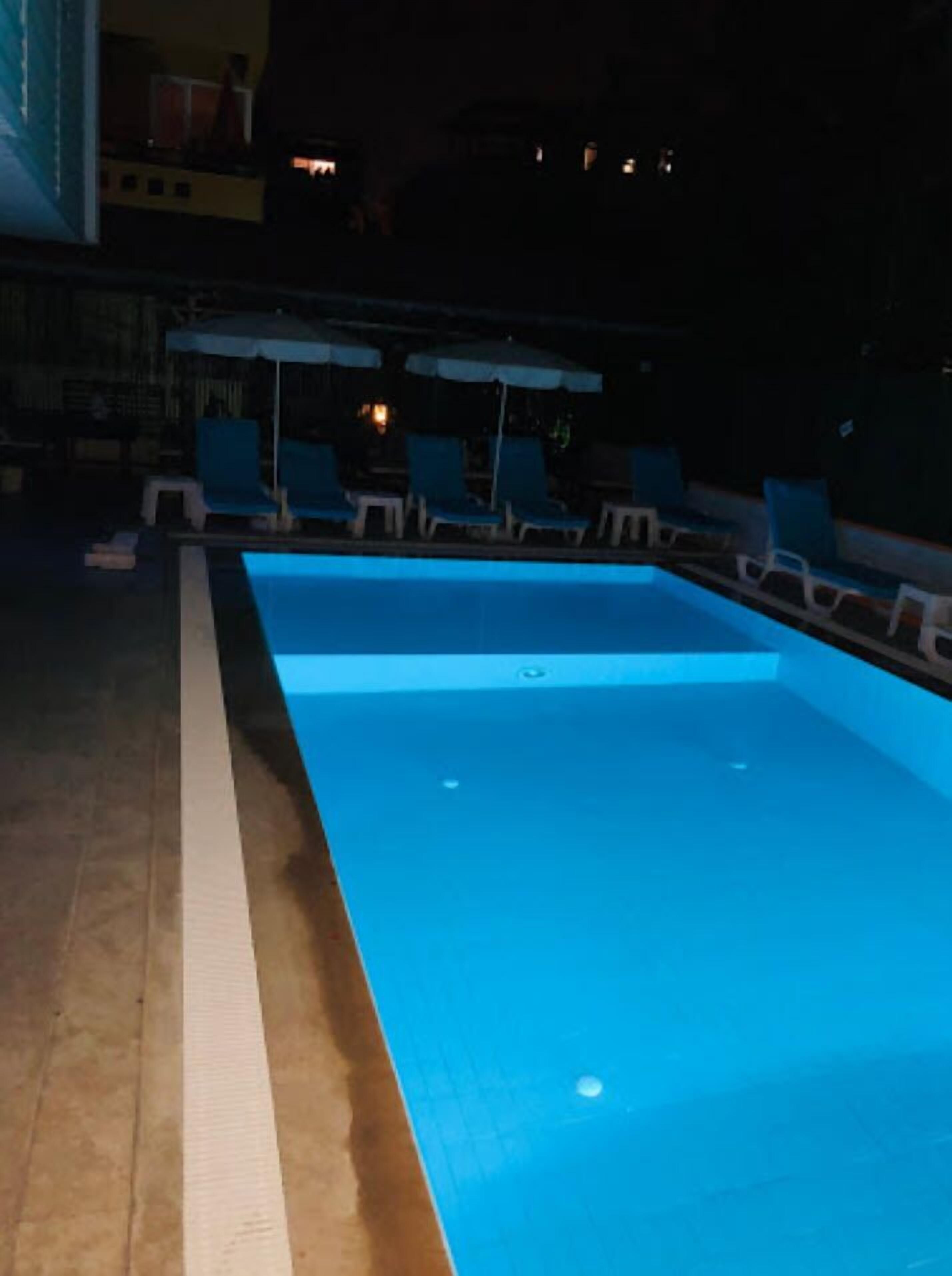 outdoor pool, pool umbrellas, pool loungers