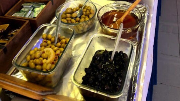 A buffet with various food items including olives, eggs, and meats. - Meltem Hotel (Konyaalti)