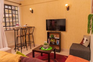 Apartment, 1 Bedroom | Living area | 40-inch Smart TV with satellite channels, TV - Kijani Apartment (Nairobi)