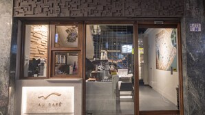 A café with a modern interior, a visible seating area, and a clear entrance.