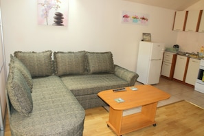 Family Apartment, Garden View | Living area | Flat-screen TV - Klaipeda-Apartments (Klaipeda)