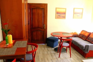 Traditional Apartment, Garden View | Living area | Flat-screen TV - Klaipeda-Apartments (Klaipeda)