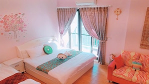 A bedroom with a bed, a nightstand, a dresser, a window with curtains, a sofa, and a wall decoration. - Birds Flower B&B (Wujie)