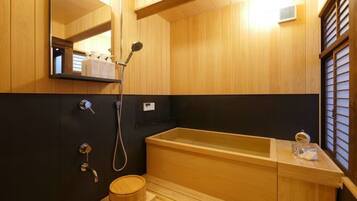 Separate bathtub and shower, free toiletries, hair dryer, slippers