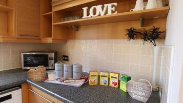 Premier Apartment | Private kitchen | Fridge, microwave, stovetop, coffee/tea maker