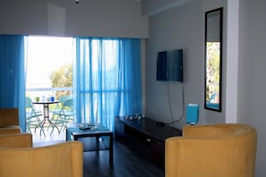 Apartment, Sea View | Living area | Flat-screen TV - Blue Coast (Limassol)