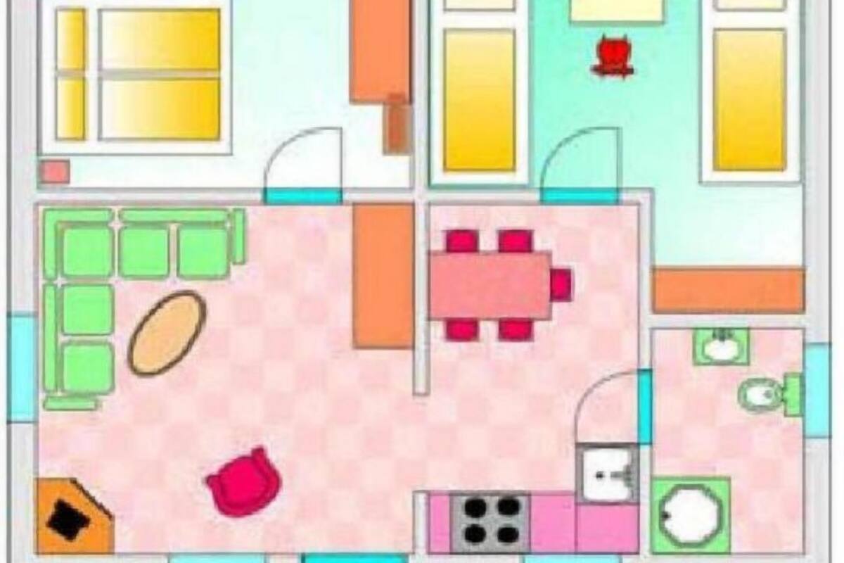 A floor plan of a hotel room with a bed, a desk, a chair, a small table, a sofa, and a bathroom.