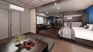 A modern hotel room with a large bed, a dining area, and a kitchenette. - MIMARU Tokyo Ginza East (Tokyo)