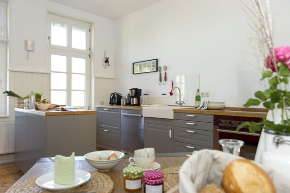Family Apartment, Garden View | Private kitchen | Full-sized fridge, oven, stovetop, coffee/tea maker