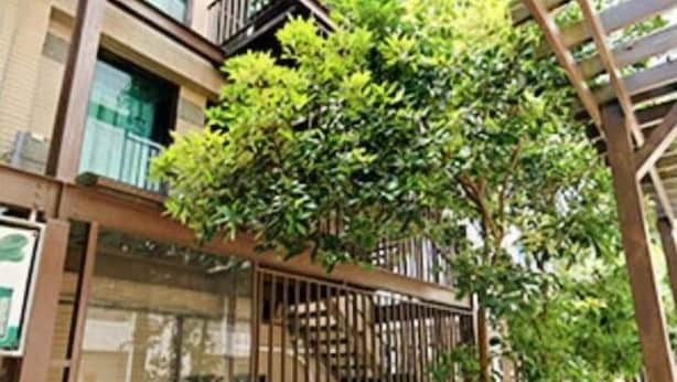 A multi-story building with a central staircase surrounded by greenery. - Yilan Jimmy Villa (Yilan)
