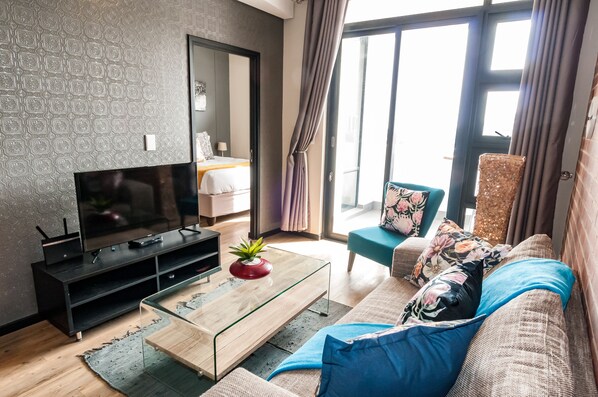 Standard Two Bedroom Apartment | Living area | Flat-screen TV