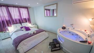 Superior Suite (Jacuzzi) | In-room safe, individually decorated, individually furnished, desk