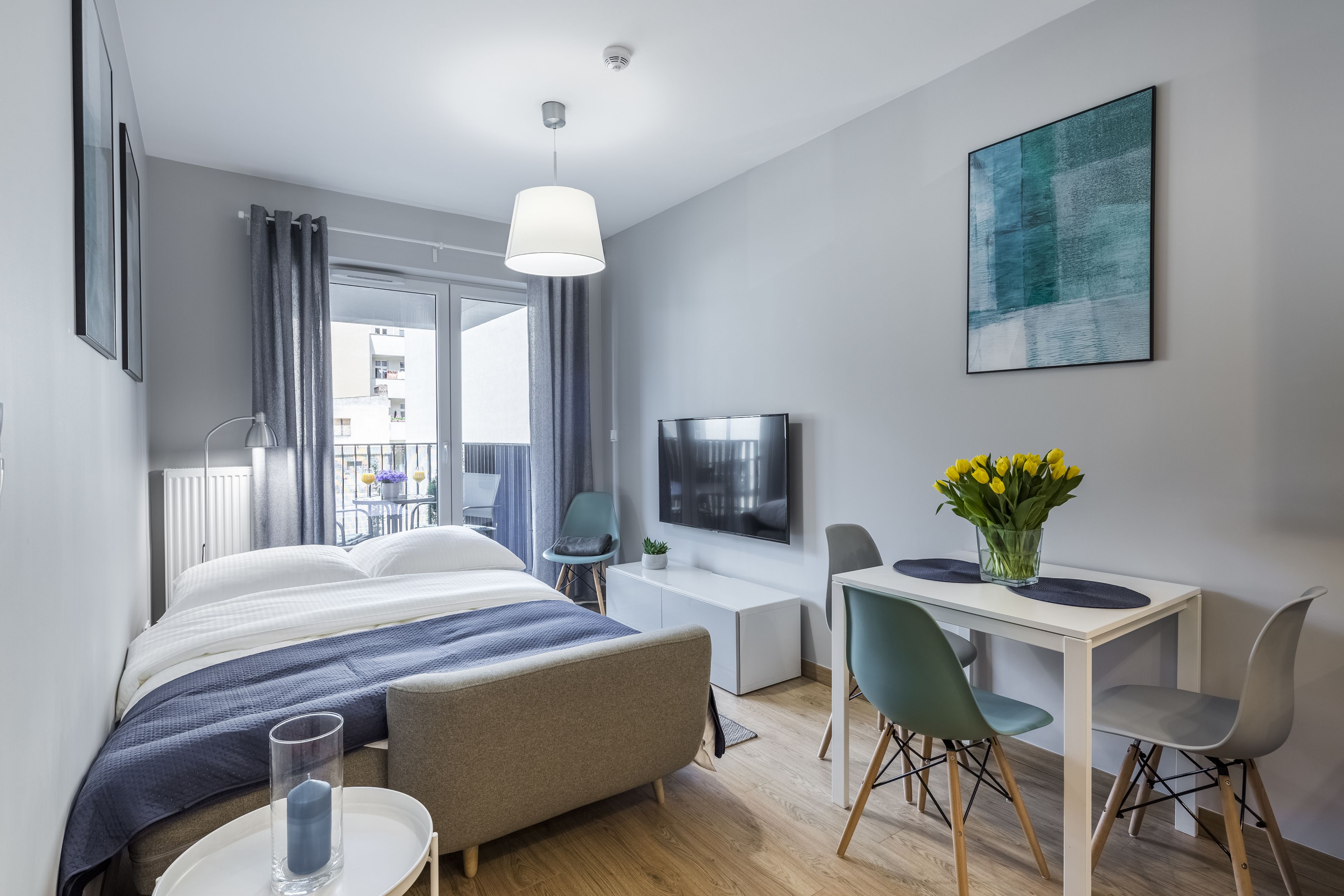 deluxe apartment, balcony | living room | 50-inch smart tv with cable channels, tv