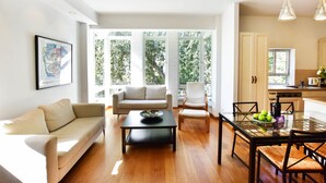 Apartment, 2 Queen Beds | Living room | Flat-screen TV