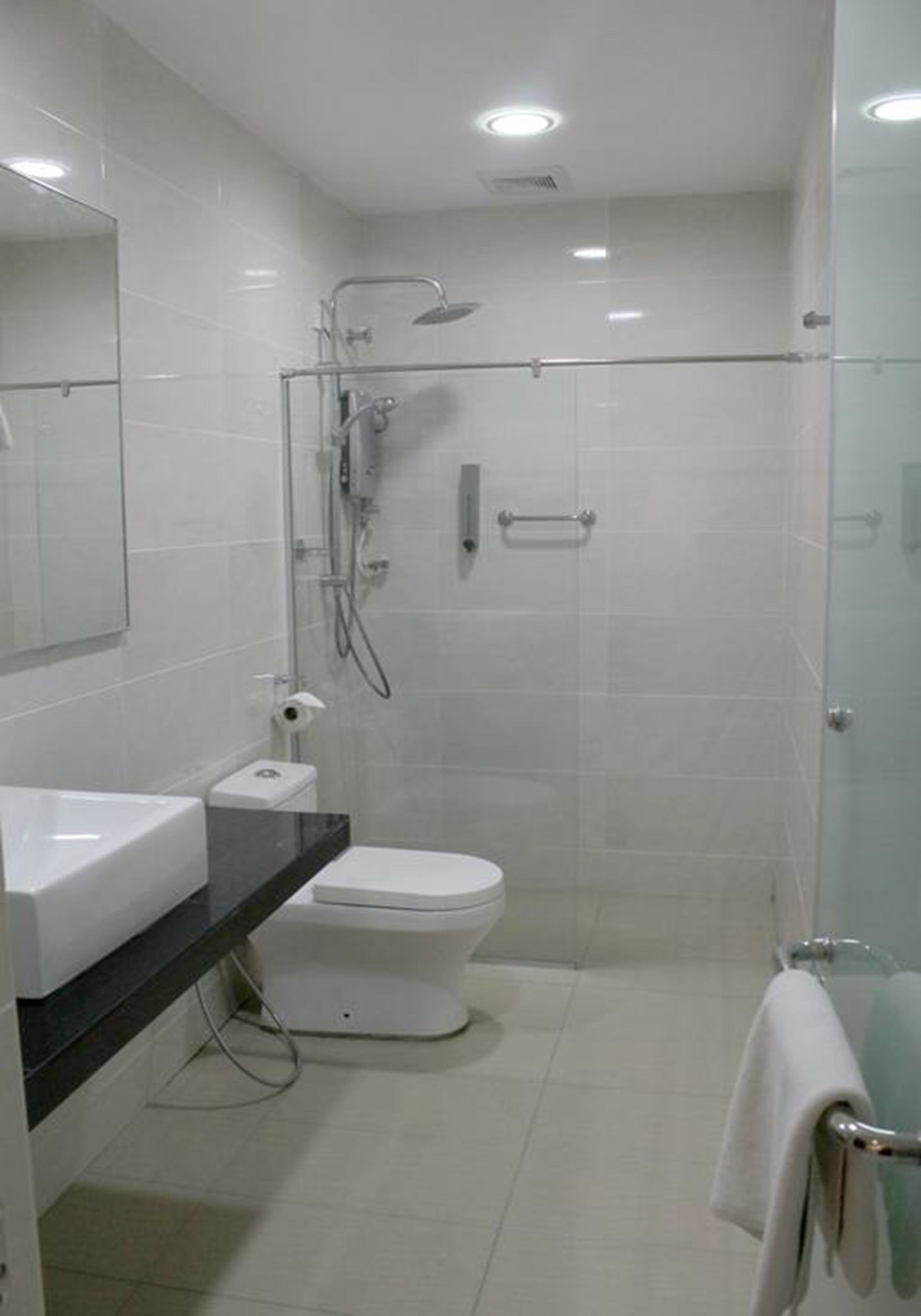 superior family room | bathroom | shower, rainfall showerhead, bidet, towels