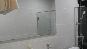 A modern bathroom with two sinks, a large mirror, and a shower area. - The View Hotel (Segamat)