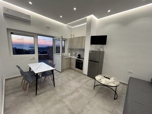 Two Bedroom Apartment with Outdoor Hot Tub Sea and Sunset View | Living area | Flat-screen TV - Aroma Cavas (Santorini)