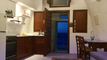 Apartment, Sea View | Private kitchen | Fridge, oven, stovetop, coffee/tea maker