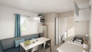 Casa rodante, 2 habitaciones, vista a la colina, en el área del jardín (A) | Área de sala de estar