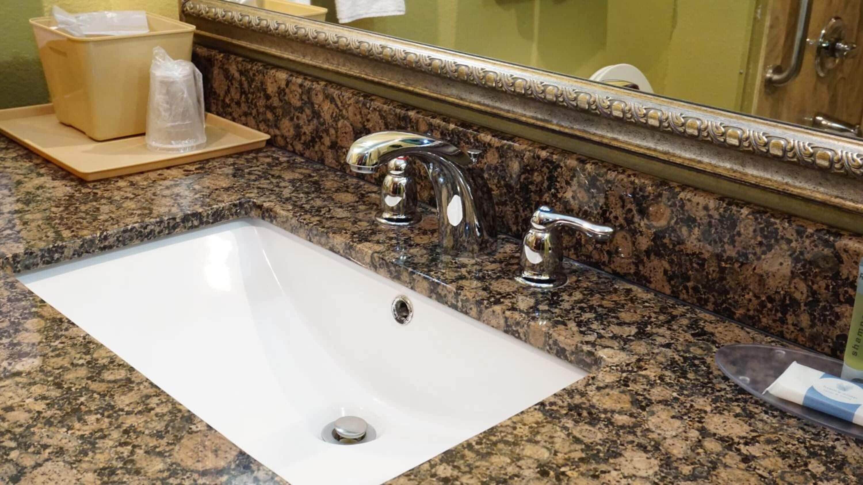 combined shower/bathtub, designer toiletries, hair dryer, towels