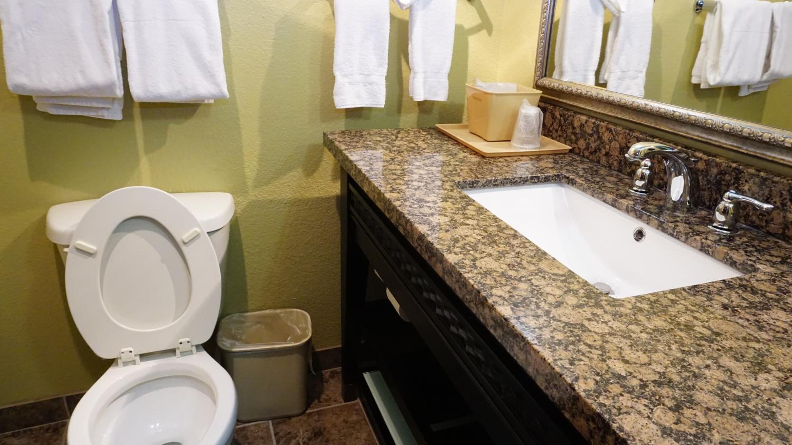 combined shower/bathtub, designer toiletries, hair dryer, towels